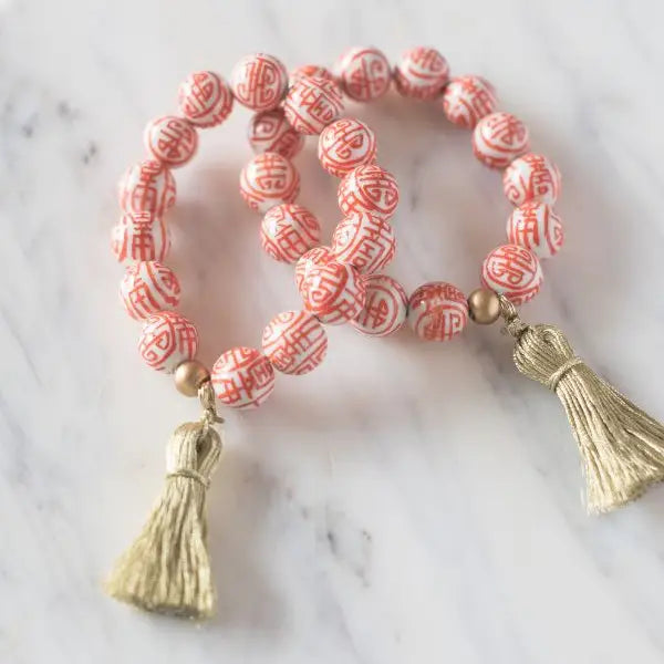 The Barre Tassel Bracelet in Orange