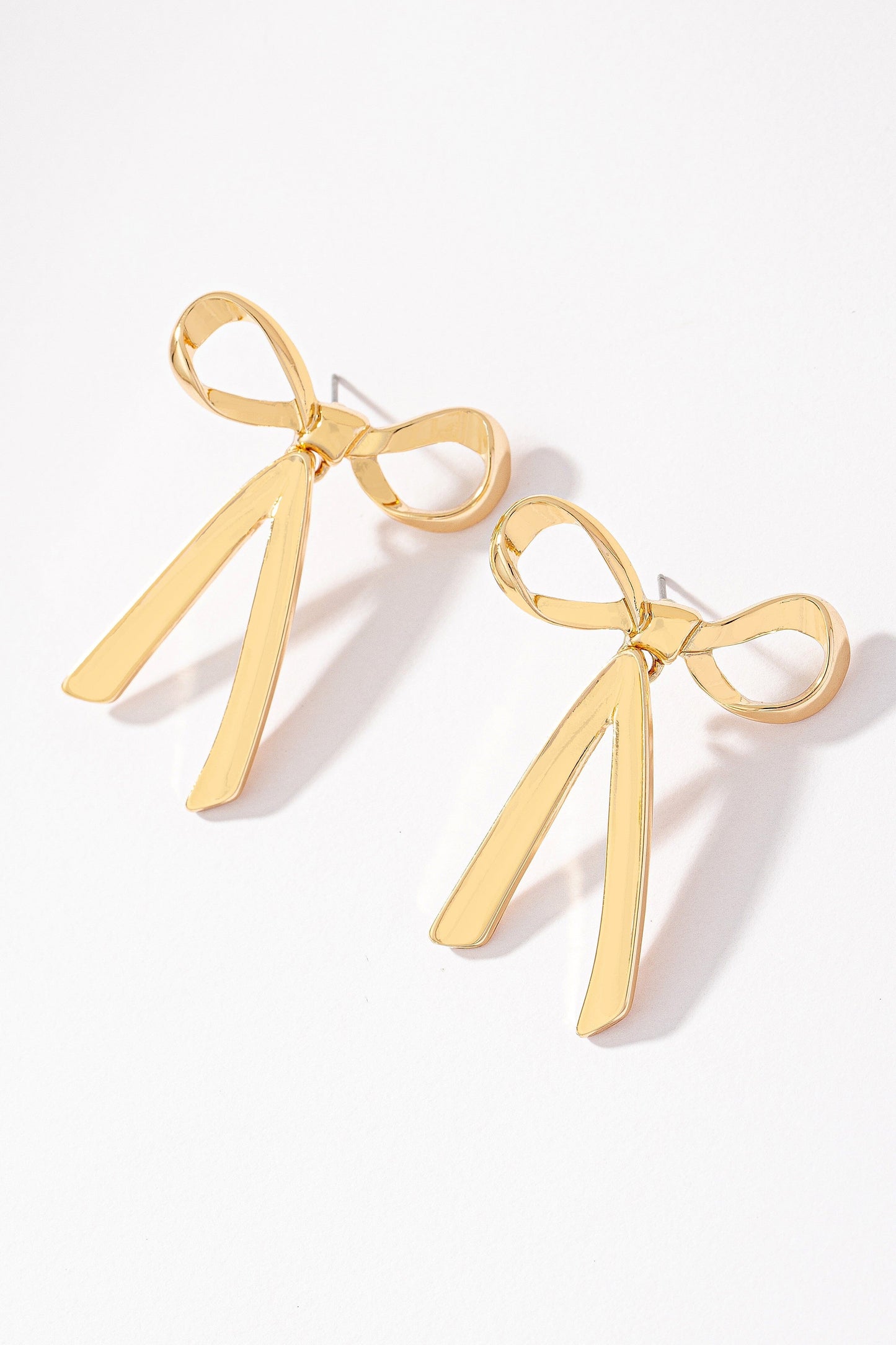 Gold Bowtie earrings with dangling bottom The Happy Southerner 